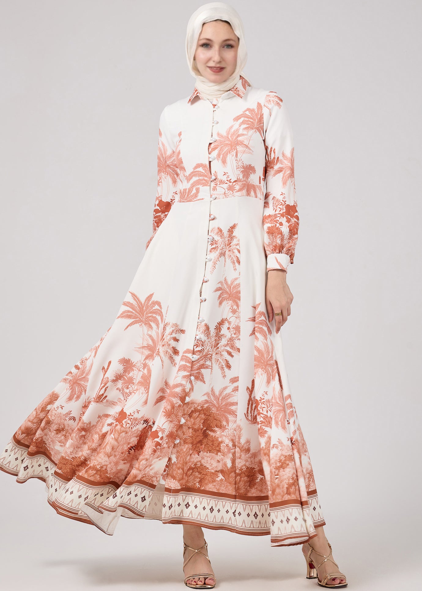 Back view of Serafina Maxi Dress with elegant palm print and cuffed sleeves, showing full length