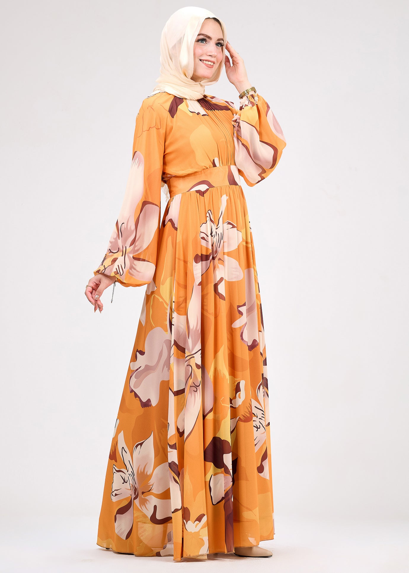 Side view of amber floral chiffon dress showcasing modest fashion