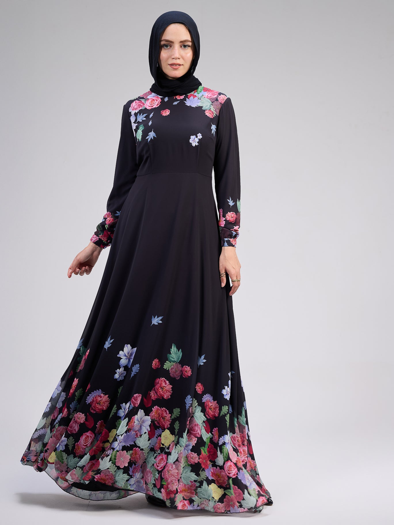 Side profile of elegant black floral chiffon dress