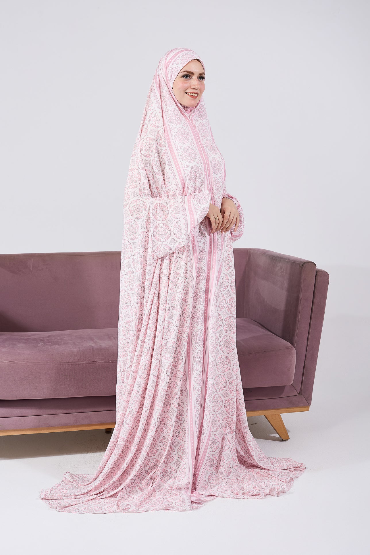 Front view of the blush satin prayer gown with floral motif
