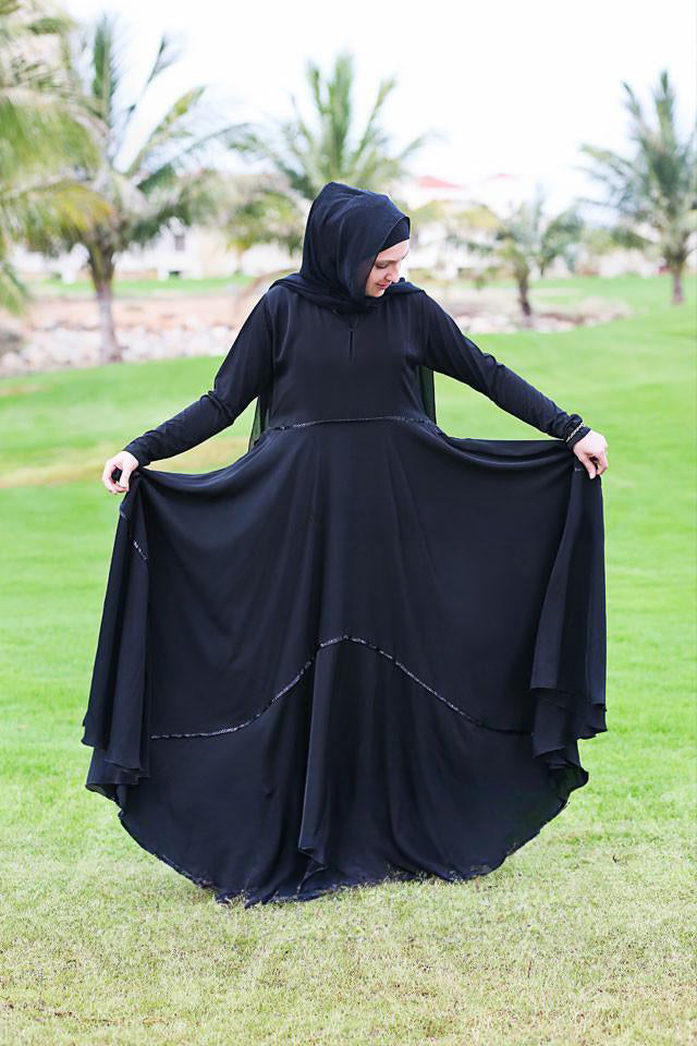 Decorative trim on black abaya skirt