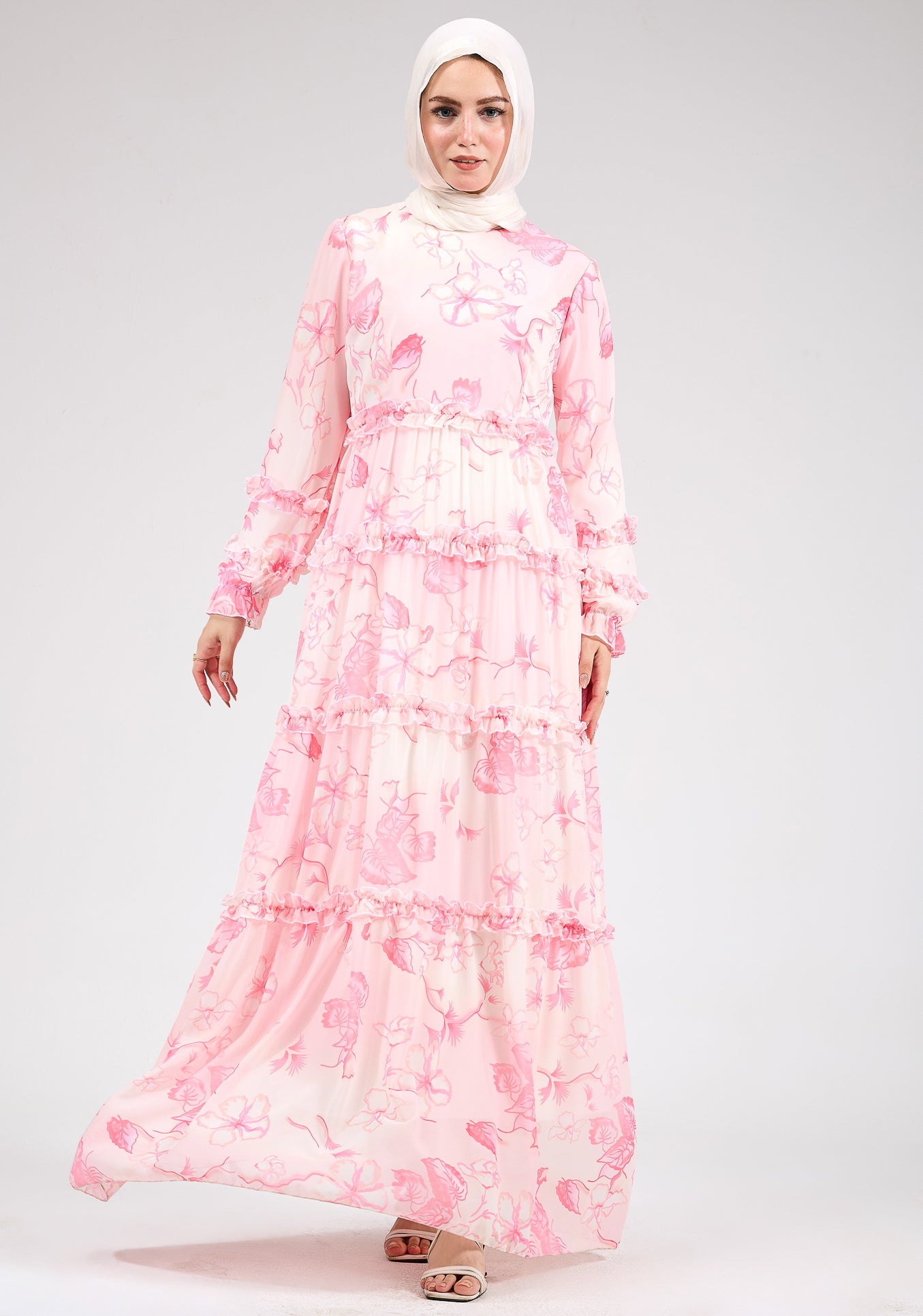 Model wearing a delicate floral chiffon maxi dress front view