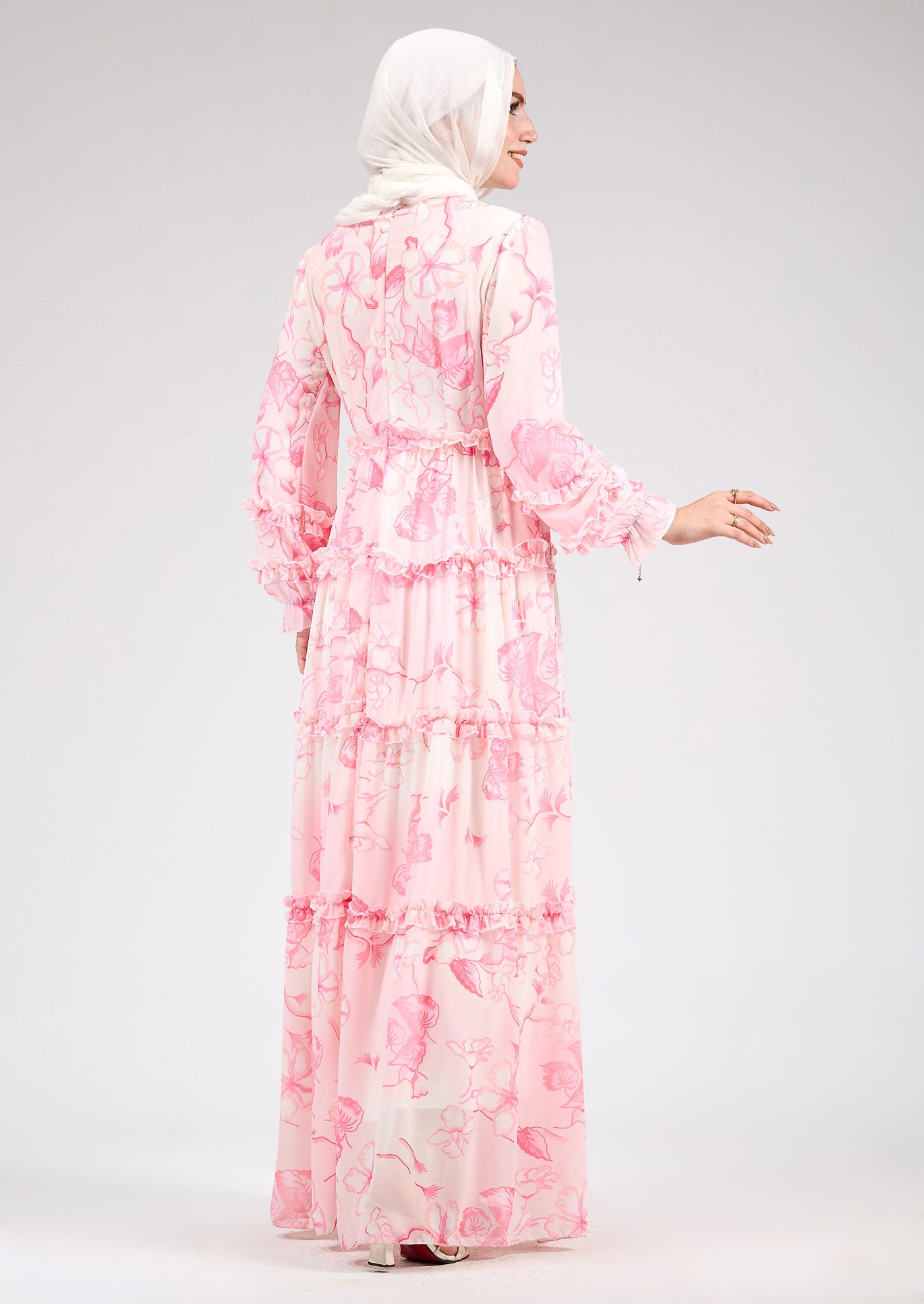 Full-body view of the model in the delicate floral chiffon maxi dress