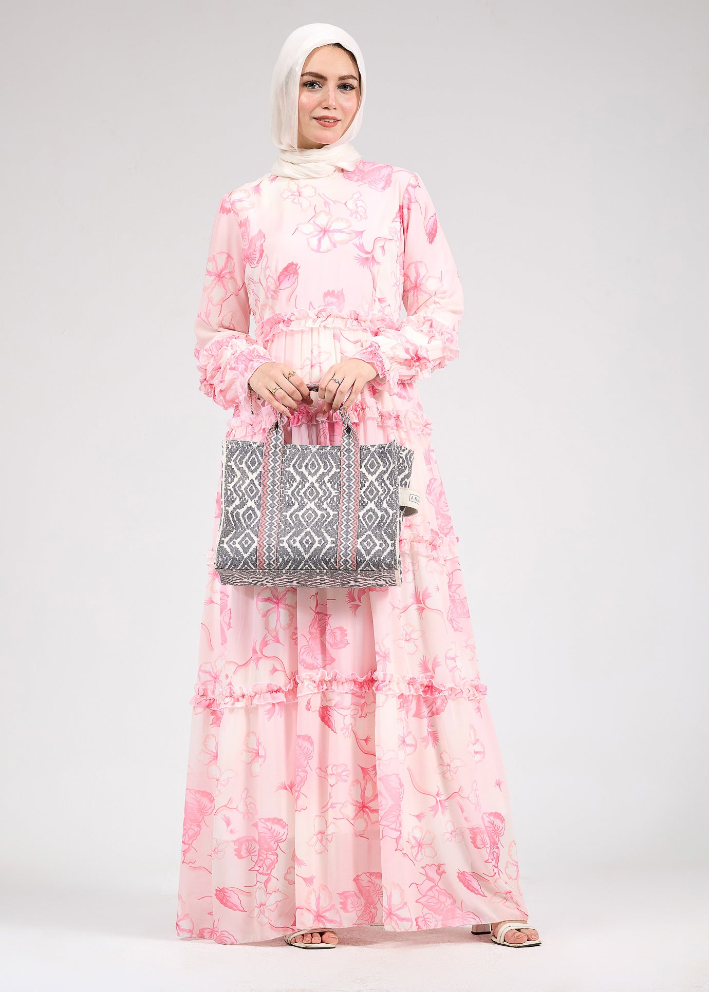 Model walking in the delicate floral chiffon maxi dress