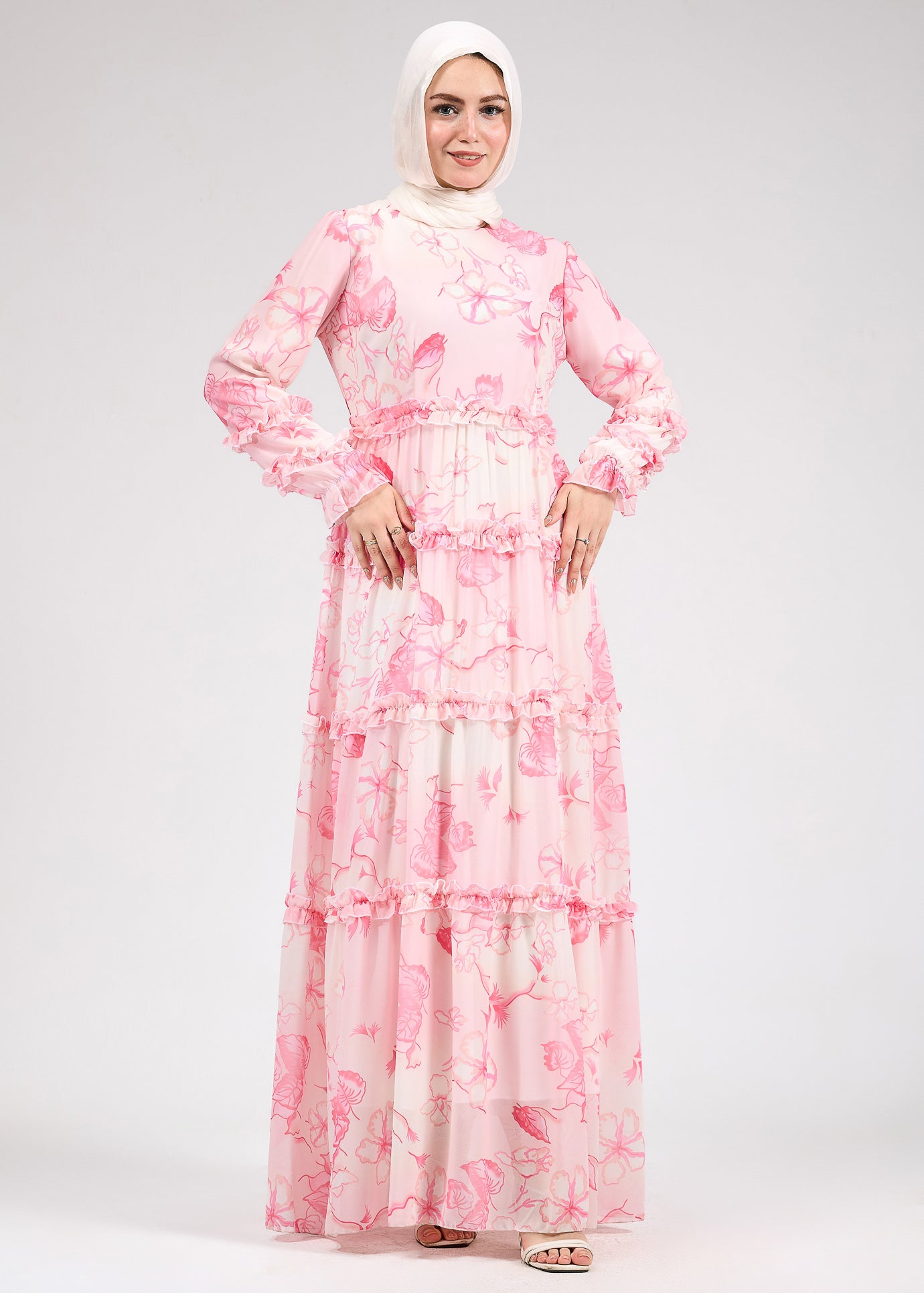 Side view of delicate floral chiffon maxi dress with ruffle tiers