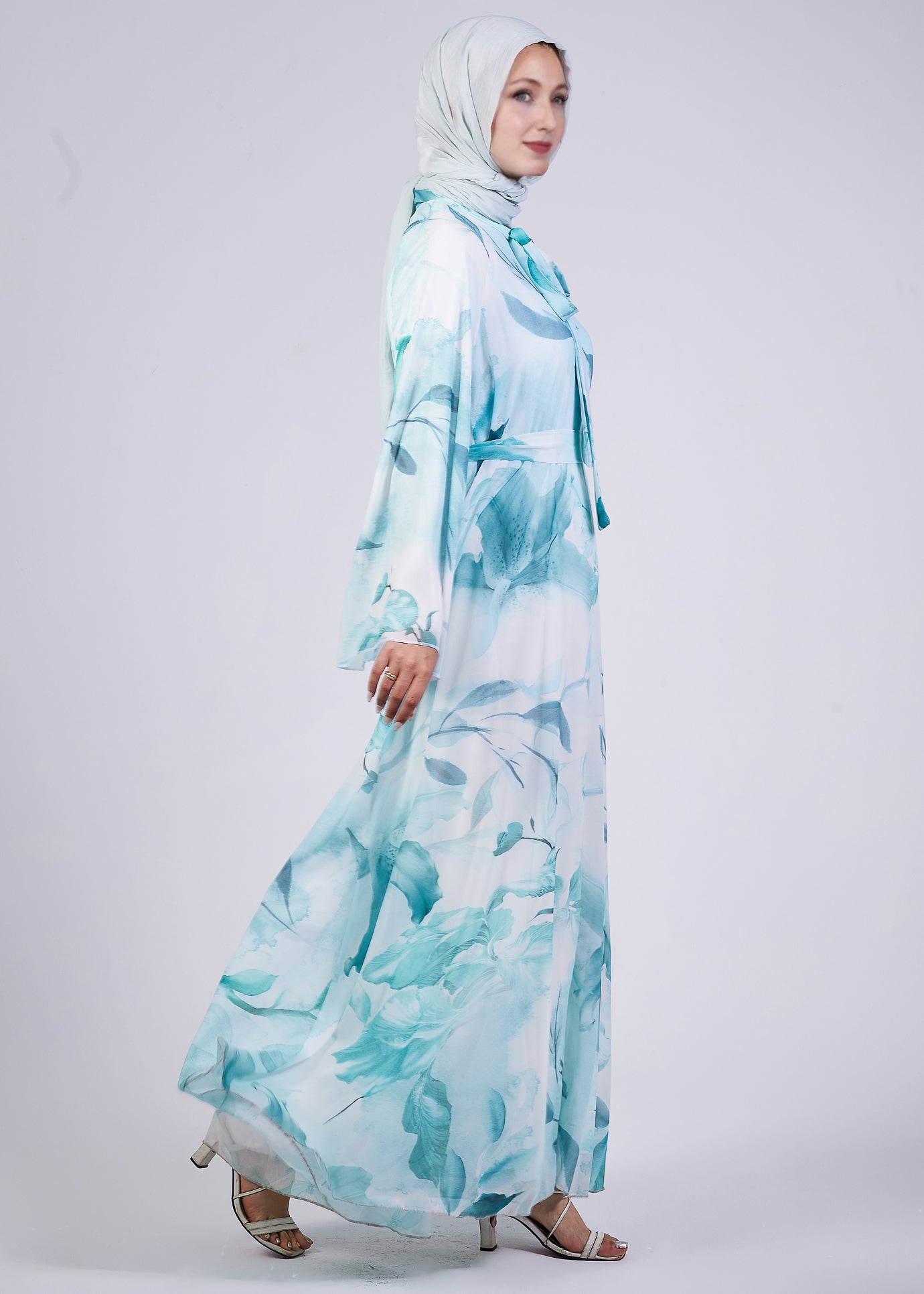 Back view of the Elegance Floral Maxi Dress featuring a belted waist