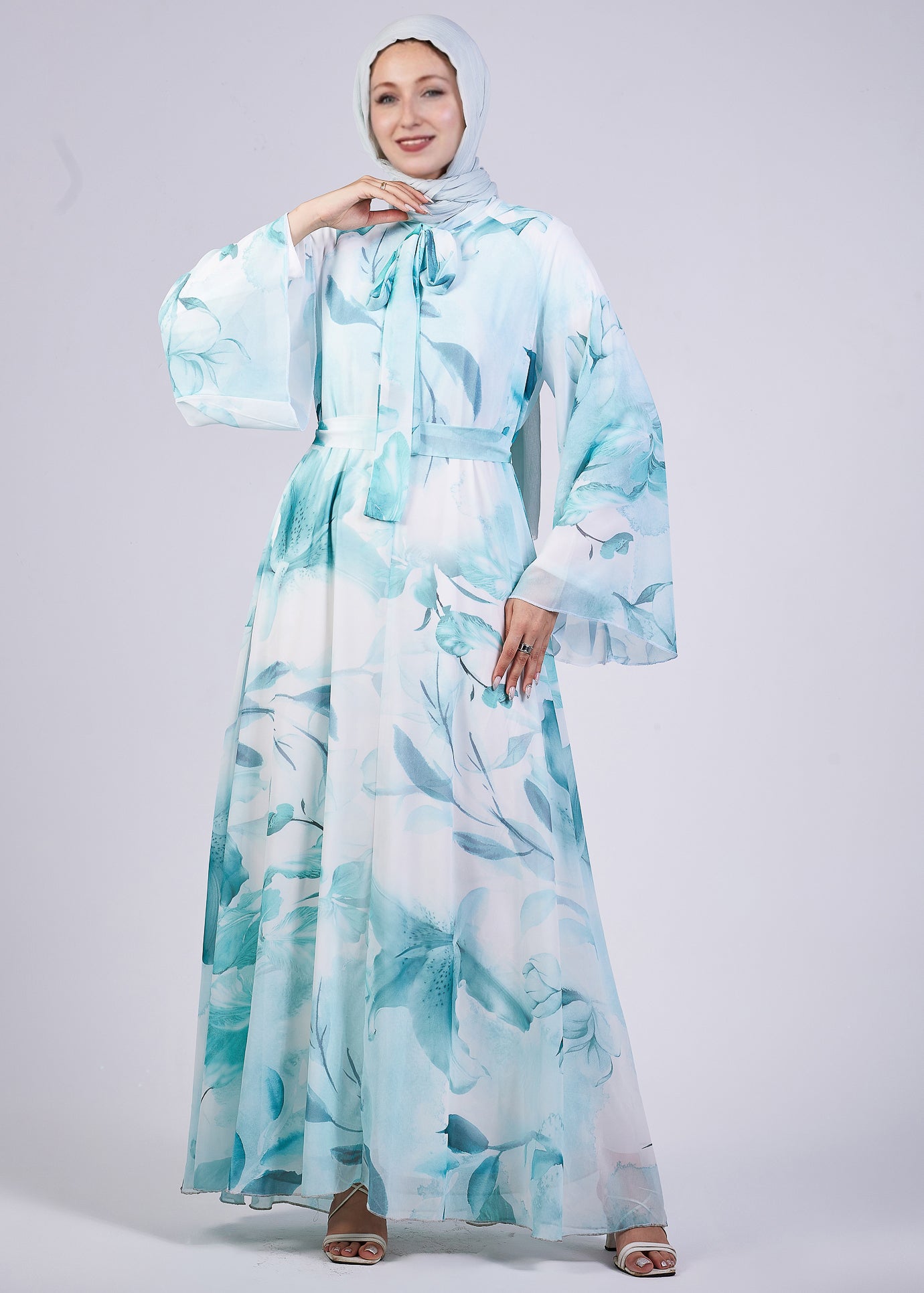 Close-up of the flowing sleeves of the Elegance Floral Maxi Dress