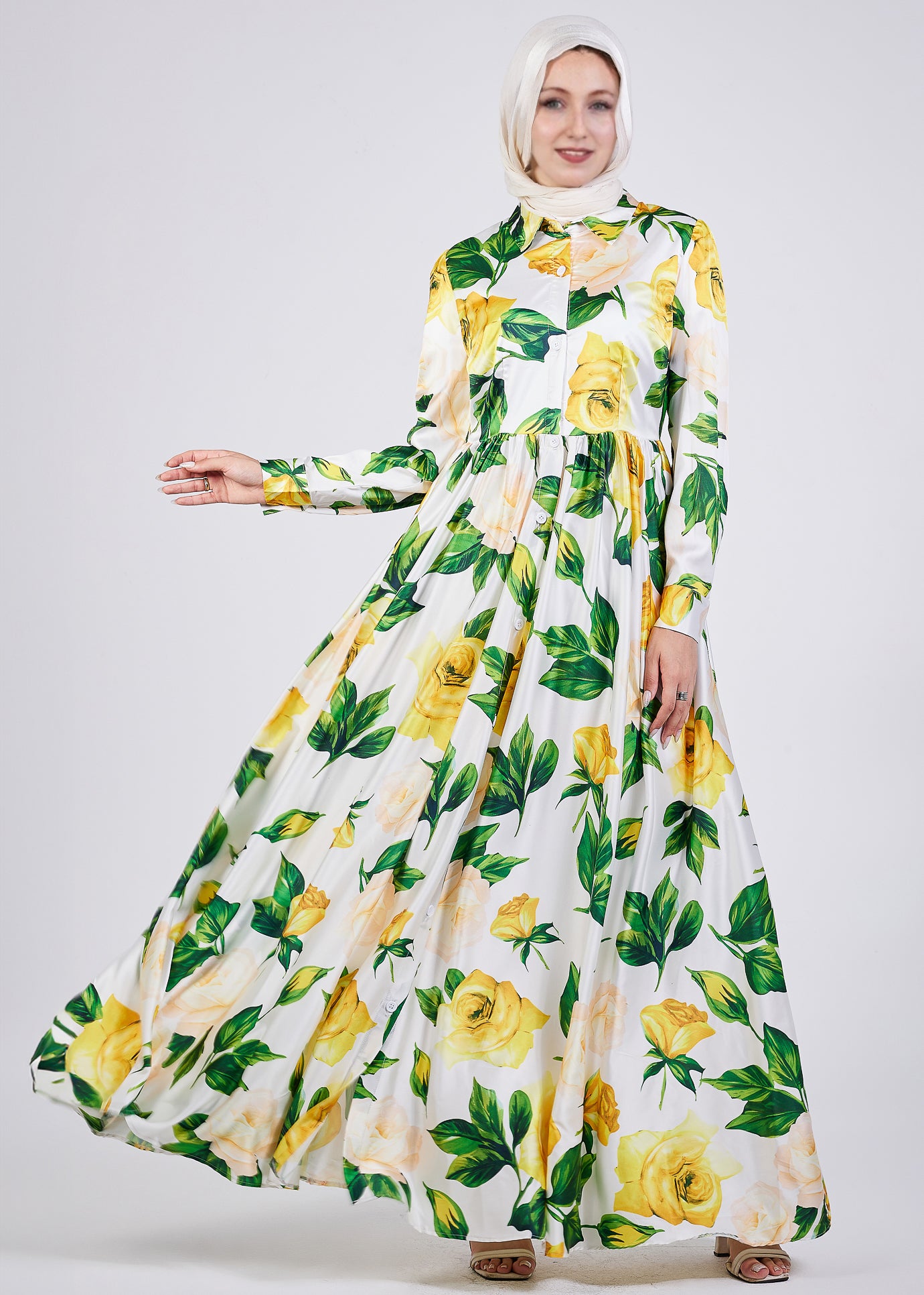 Full-length view of the Elegance Satin Maxi Dress in yellow floral design