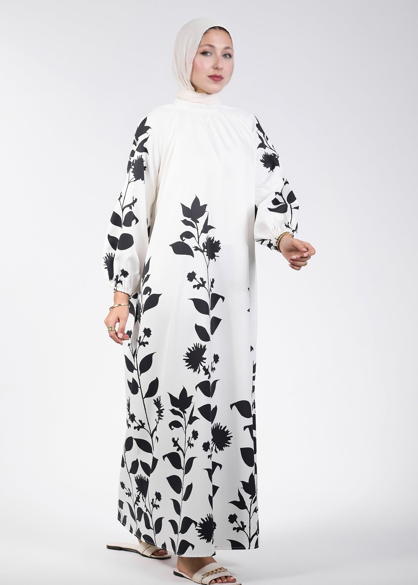 Back view of elegant floral printed maxi dress with raglan sleeves