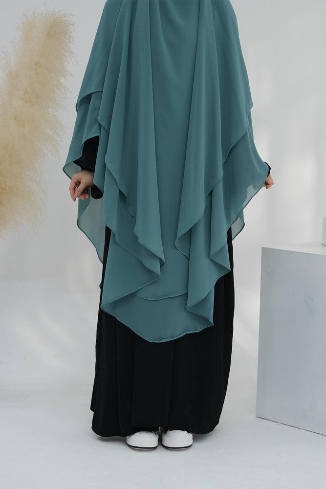 Side view of elegant two-layer chiffon khimar scarf