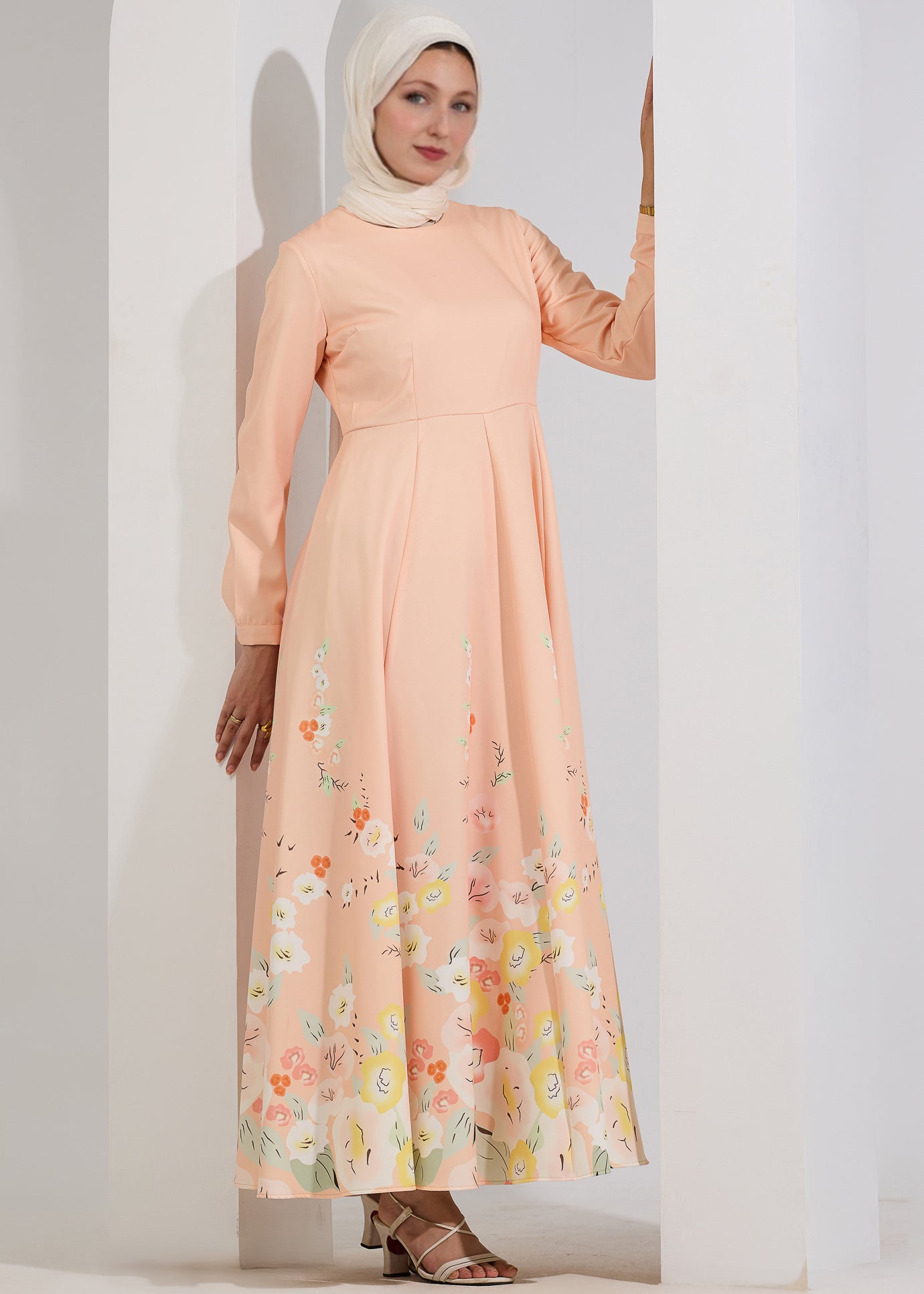 Side view of Ethereal Blush Floral Modest Maxi Dress highlighting the floral hem