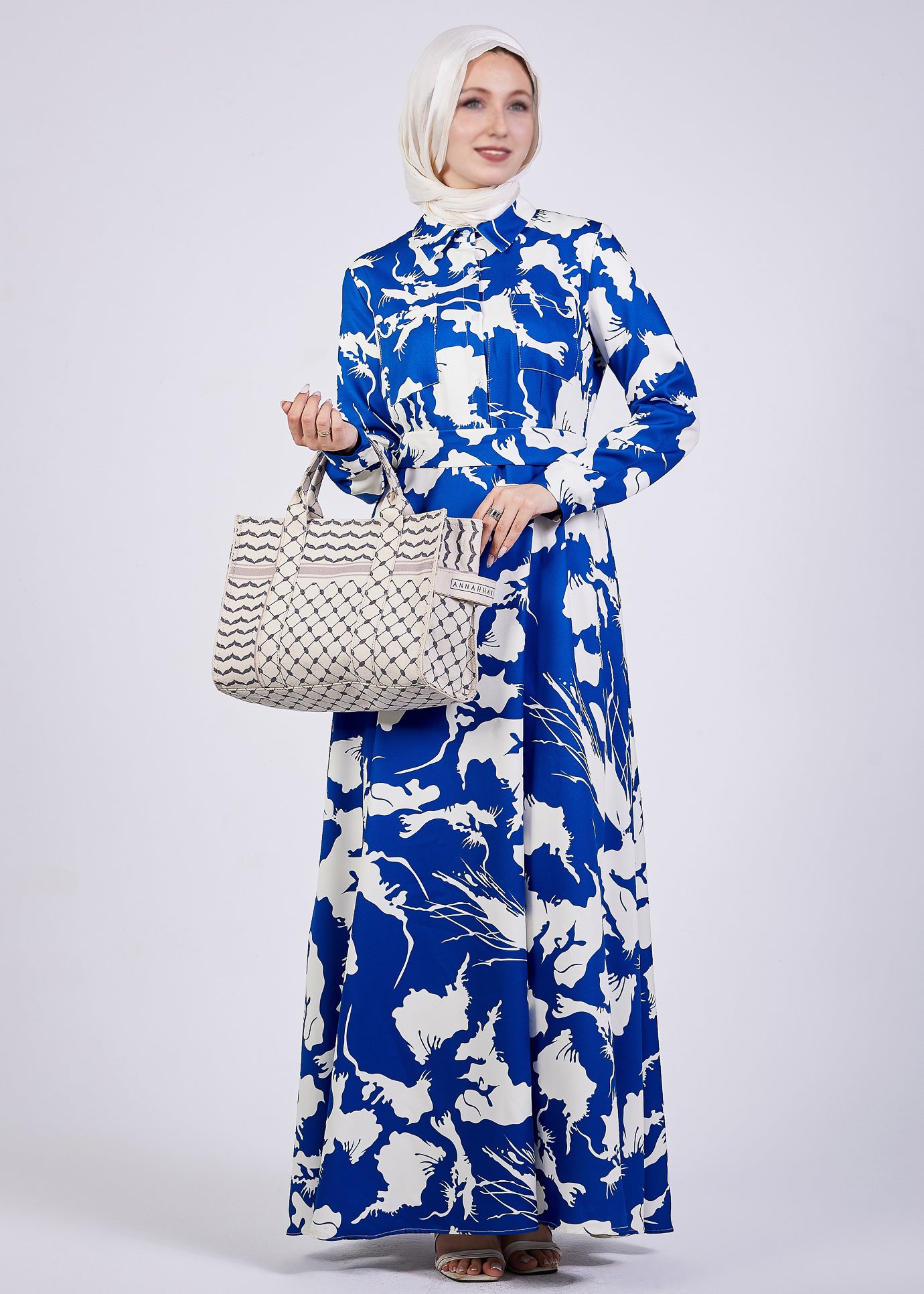 Detail view of the hand and sleeve on Evelyn Abstract Floral Crepe Maxi Dress
