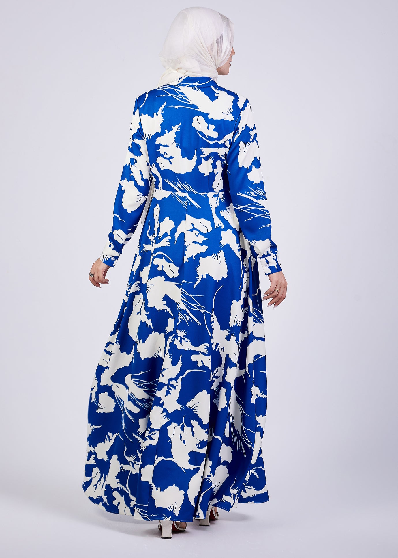 Side view of Evelyn Abstract Floral Crepe Maxi Dress with a smile