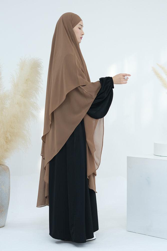 Detail of the extra-long chiffon khimar in khaki