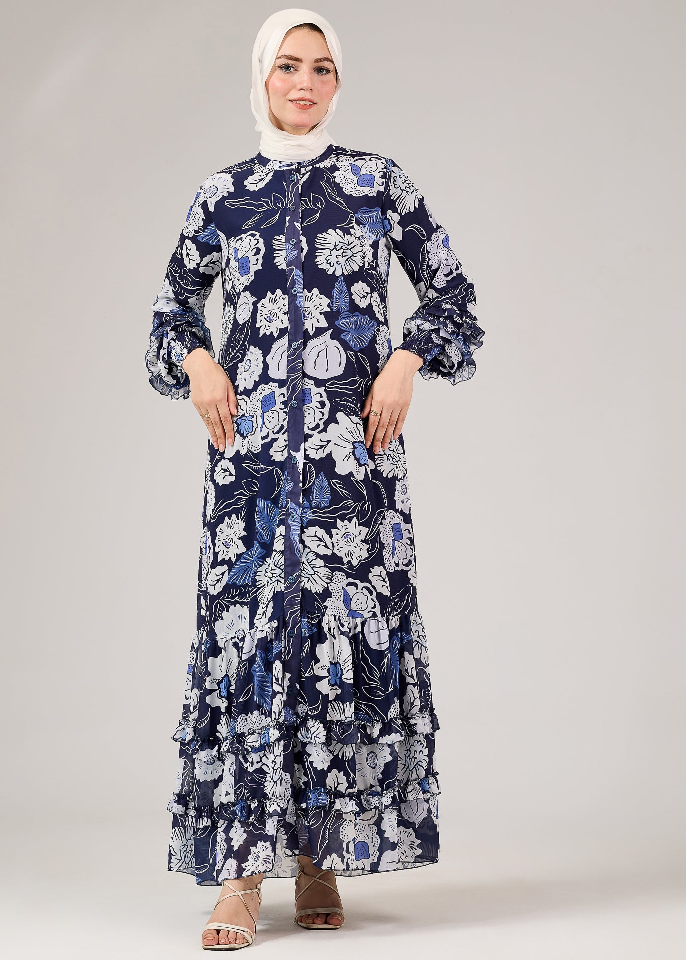 Floral chiffon modest dress front view with tiered ruffle hem