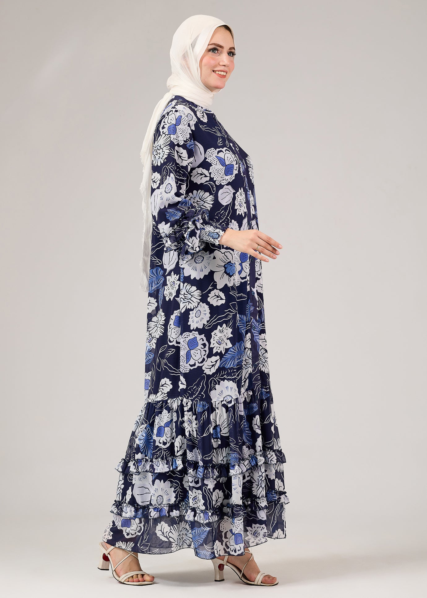 Side view of floral chiffon modest dress with flared sleeves