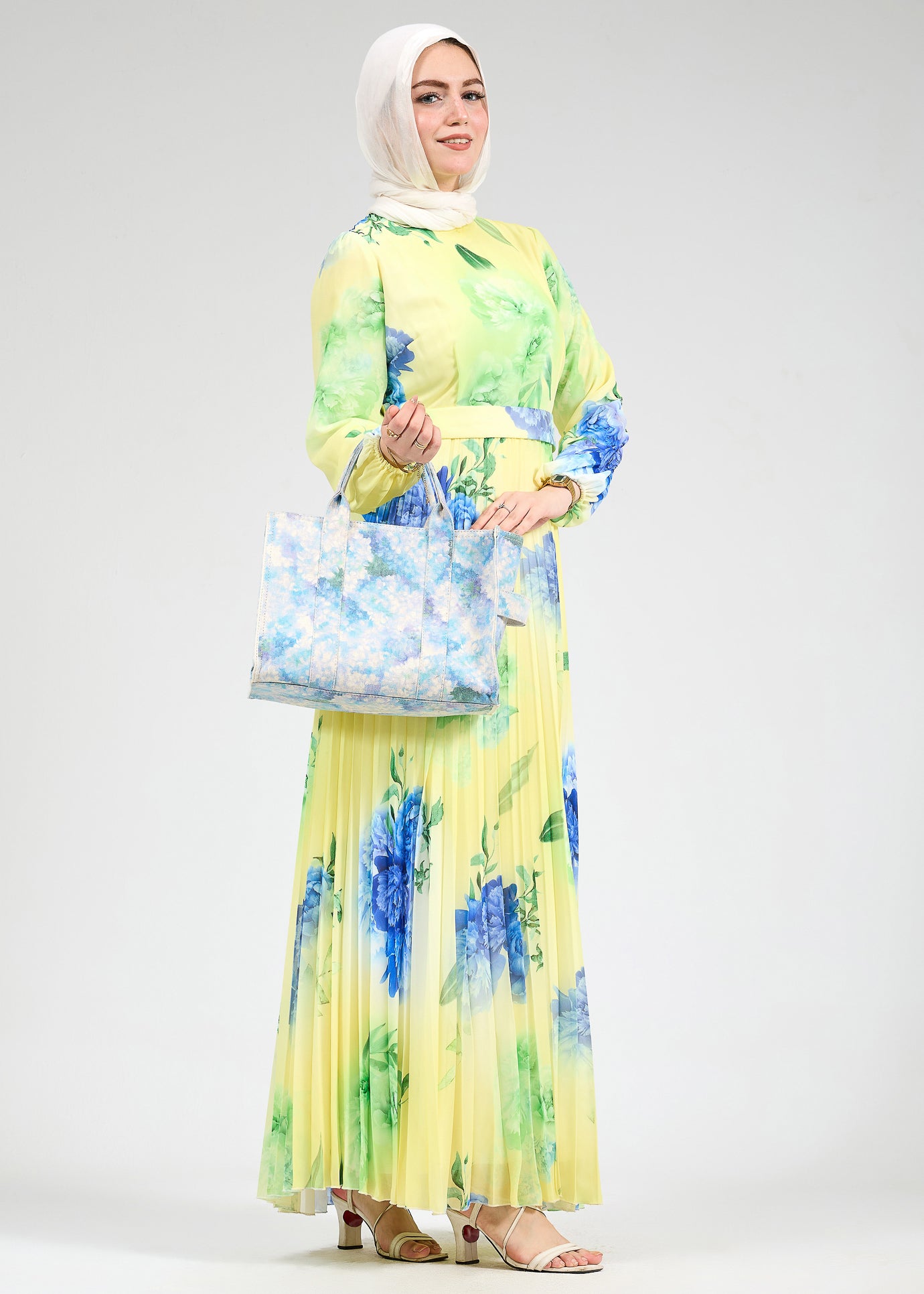 Back view of floral chiffon maxi dress with pleated skirt
