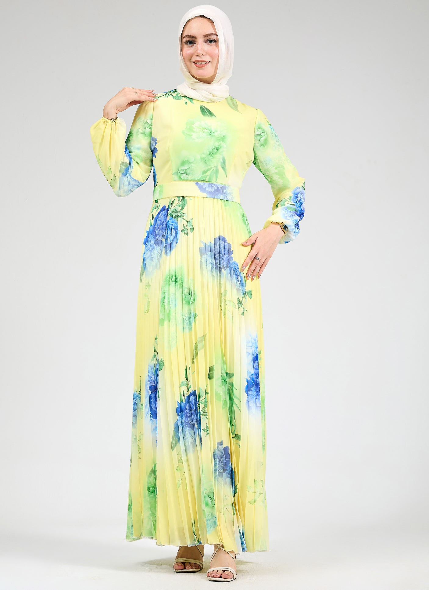 Styled floral chiffon maxi dress with blue and green floral accents
