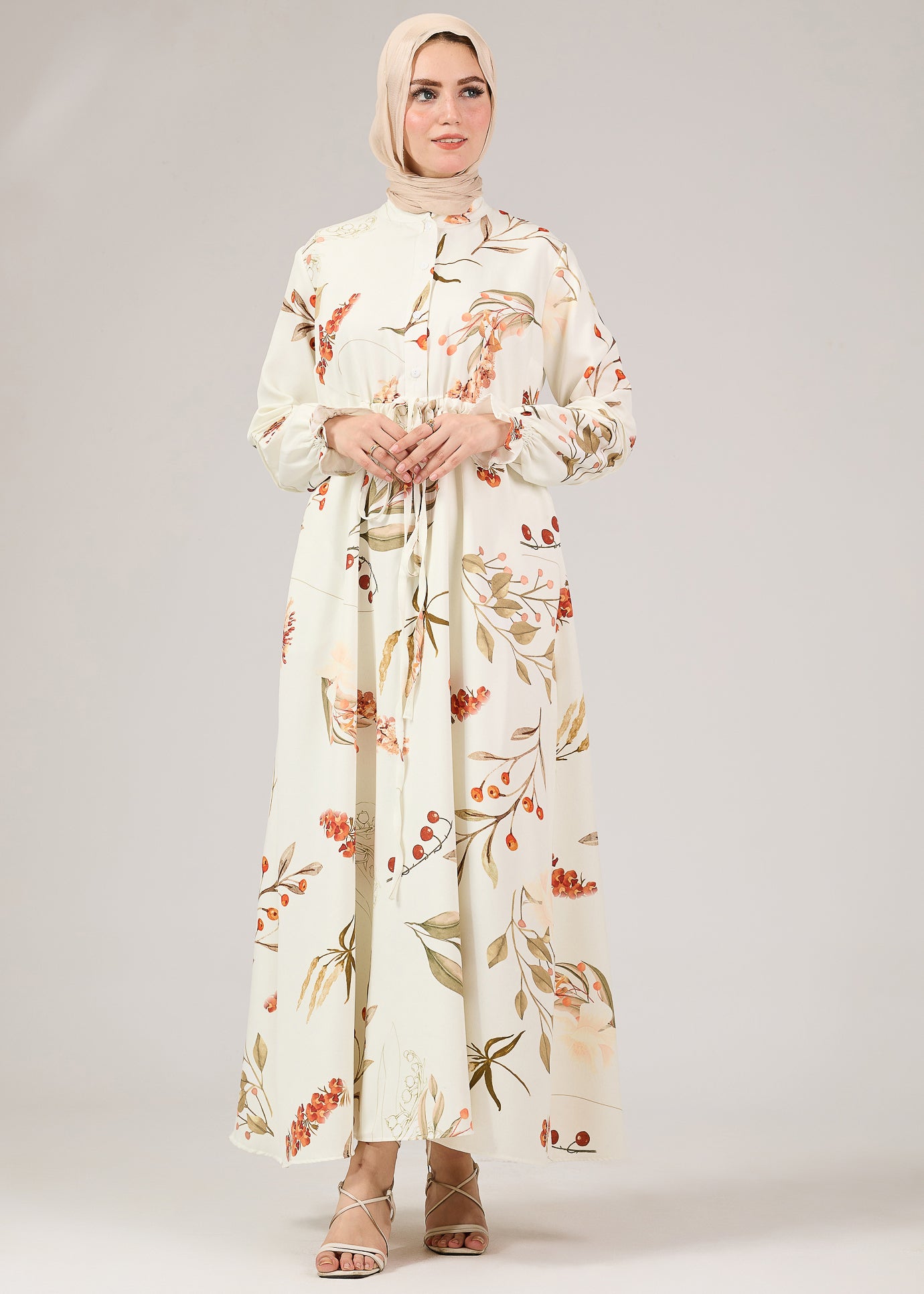 Close-up of sleeve detail on floral crepe polyester maxi dress
