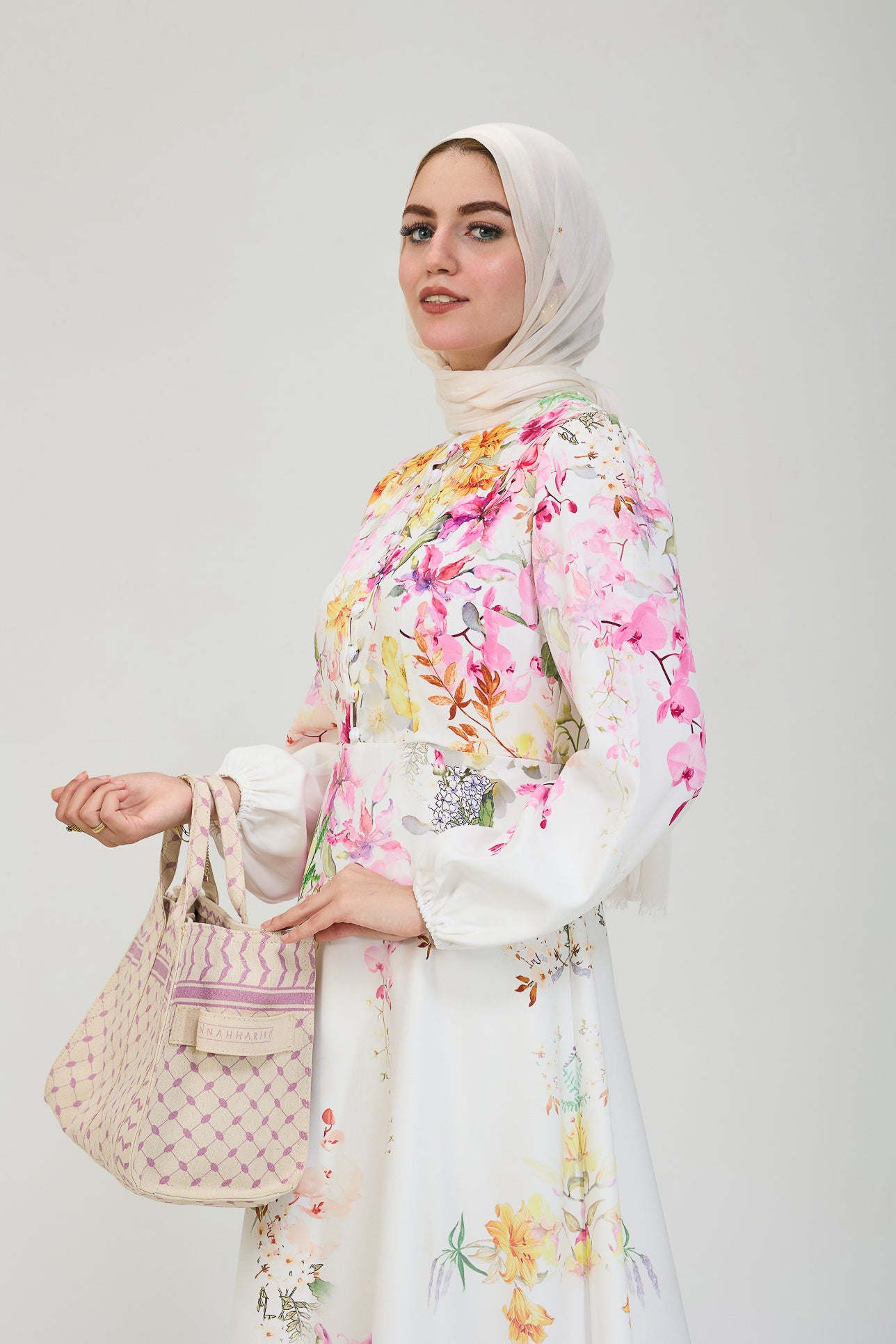 Model styling floral elegance modesty dress with hijab
