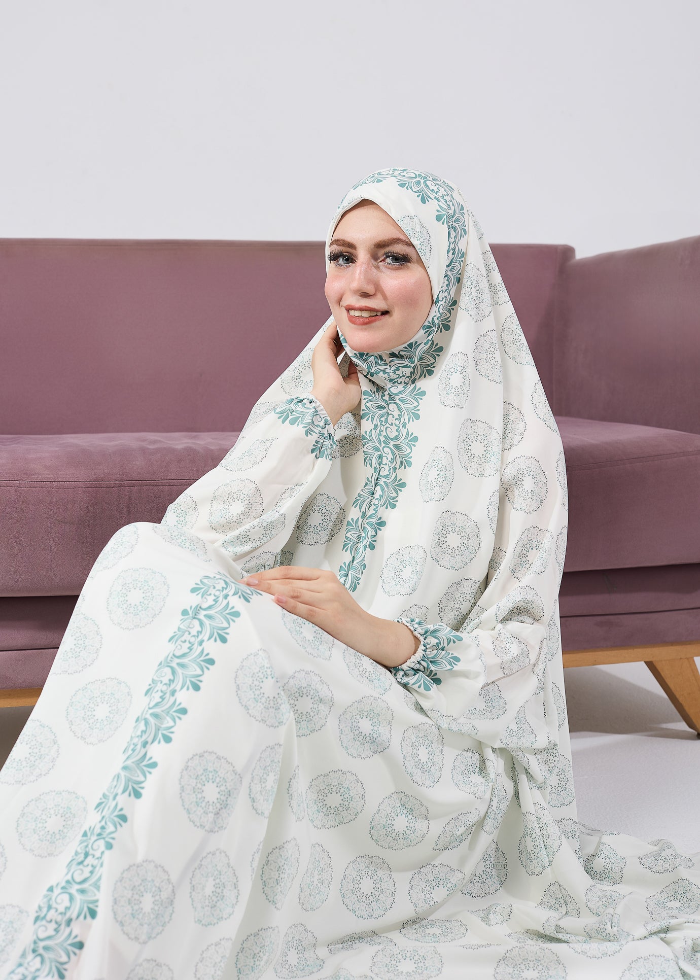 Side profile of a woman in a floral satin prayer gown