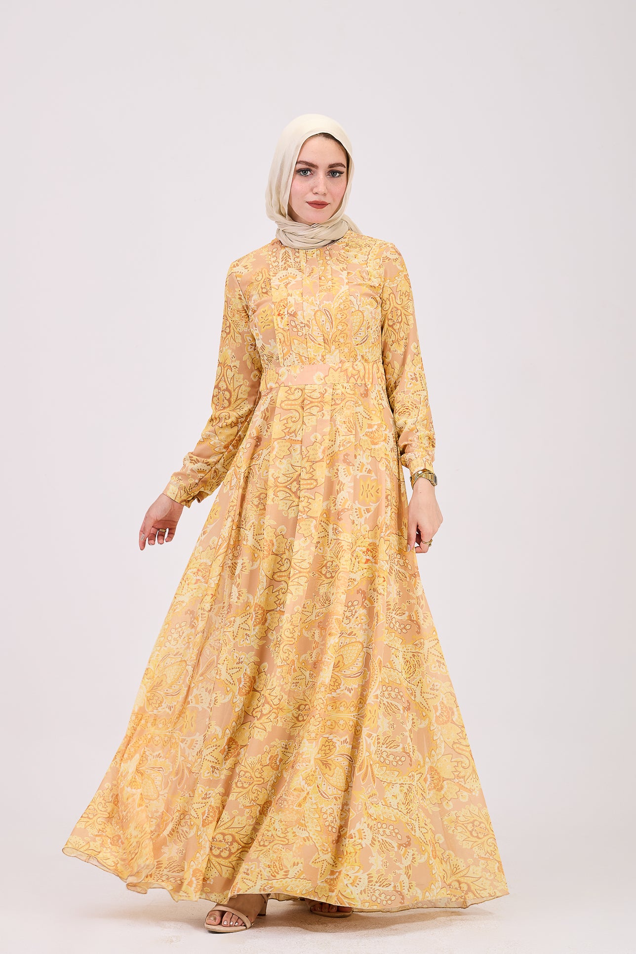 Model wearing golden yellow floral hijab dress