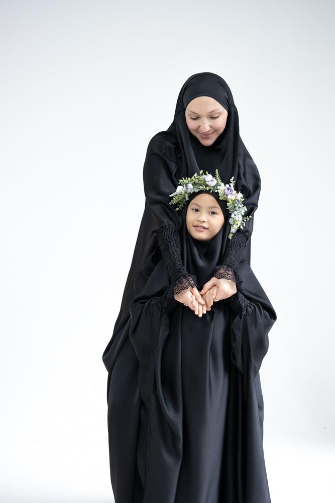 Gretaah prayer gown in khimar style with ribbed sleeve and lace cuff in Black - ANNAH HARIRI