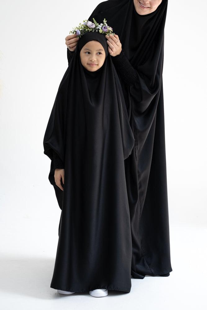 Gretaah prayer gown in khimar style with ribbed sleeve and lace cuff in Black - ANNAH HARIRI