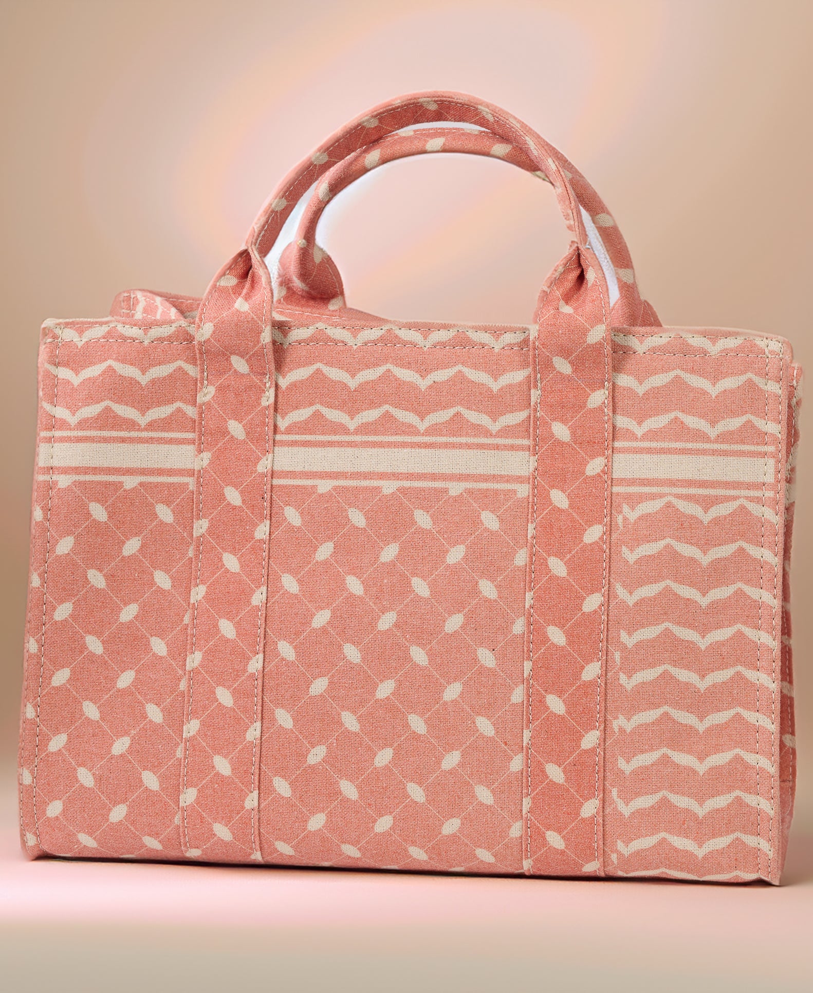 Interior view of the Heritage Coral and Cream Medium Tote showing pockets and compartments