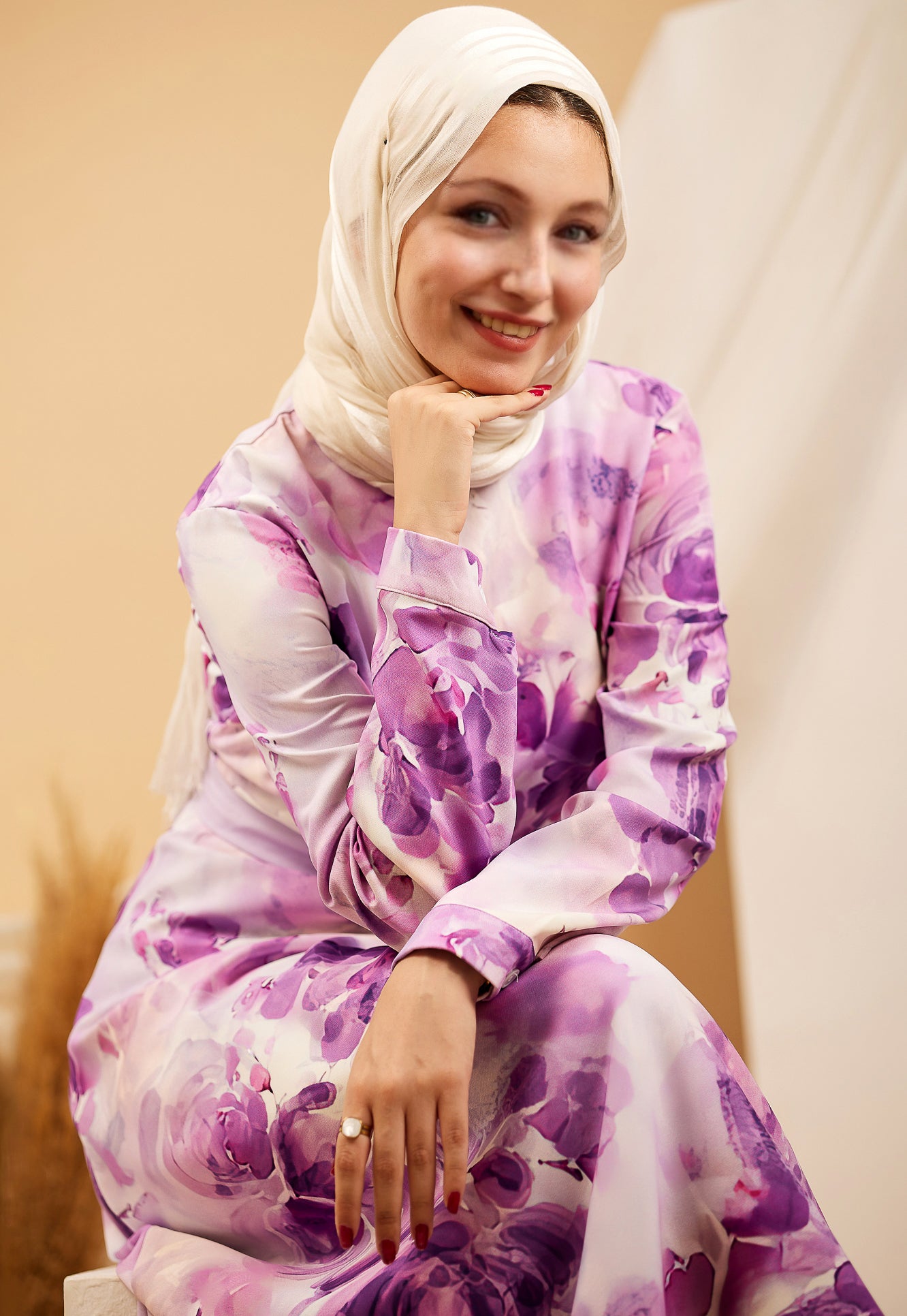 Model sitting in the Lavender Floral Crepe Polyester Maxi Dress, showing the modest design