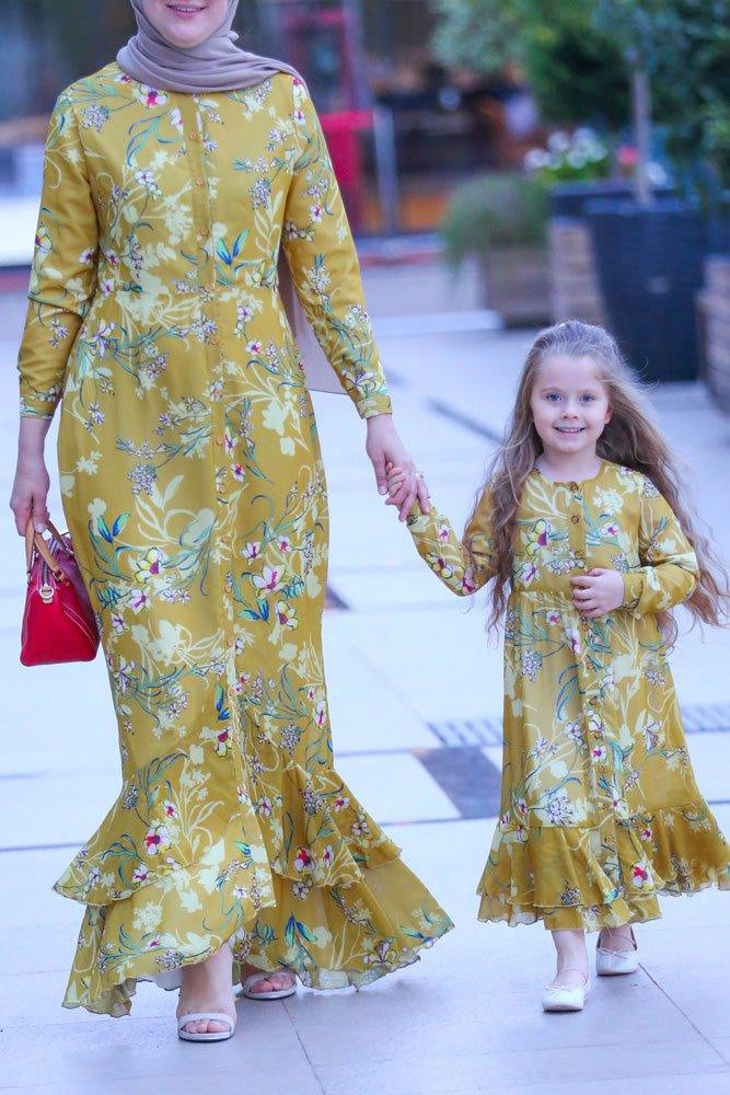 Girl holding hands with mom while wearing Mini Amara Floral Chiffon Dress