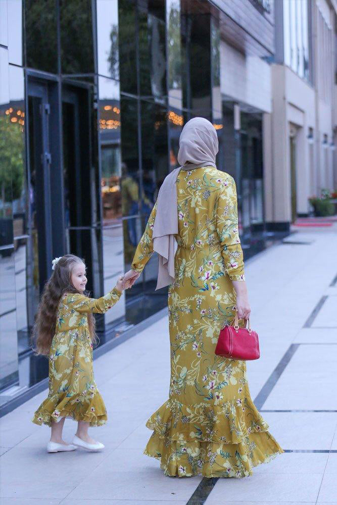 Back view of the Mini Amara Floral Chiffon Dress with flowing design