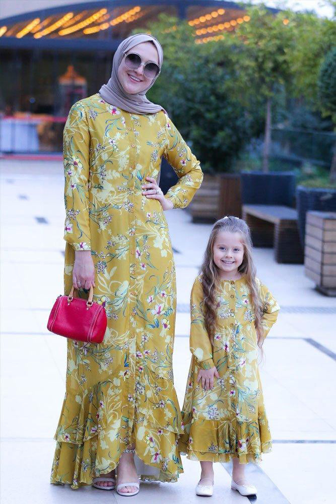 Mother and daughter walking in matching Mini Amara Floral Chiffon Dresses