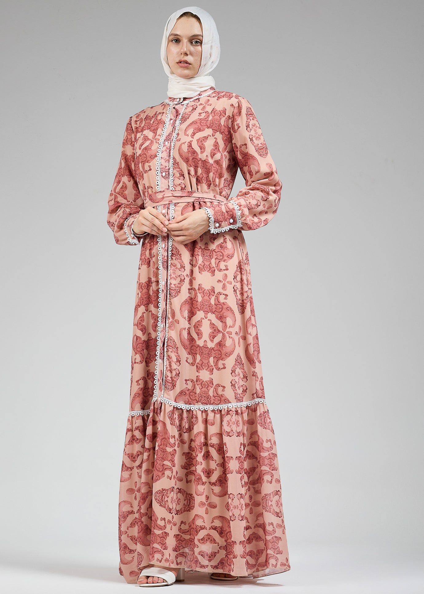 Full-length view of modest blush floral lace-trimmed chiffon dress