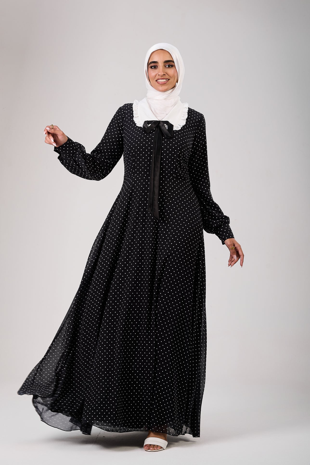 Full-length view of polka dot chiffon modesty maxi dress