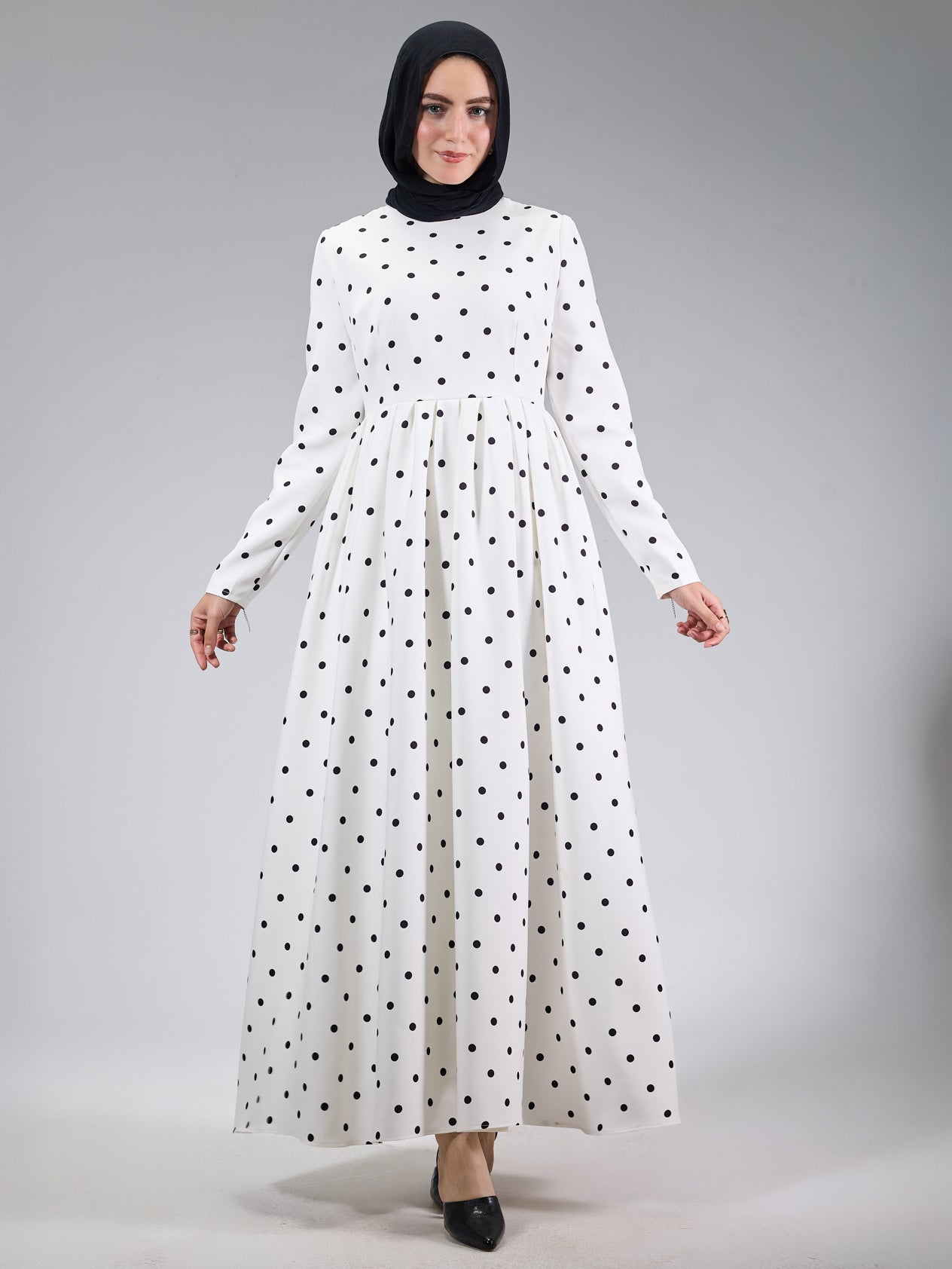 Twirling shot of the polka dot modesty dress