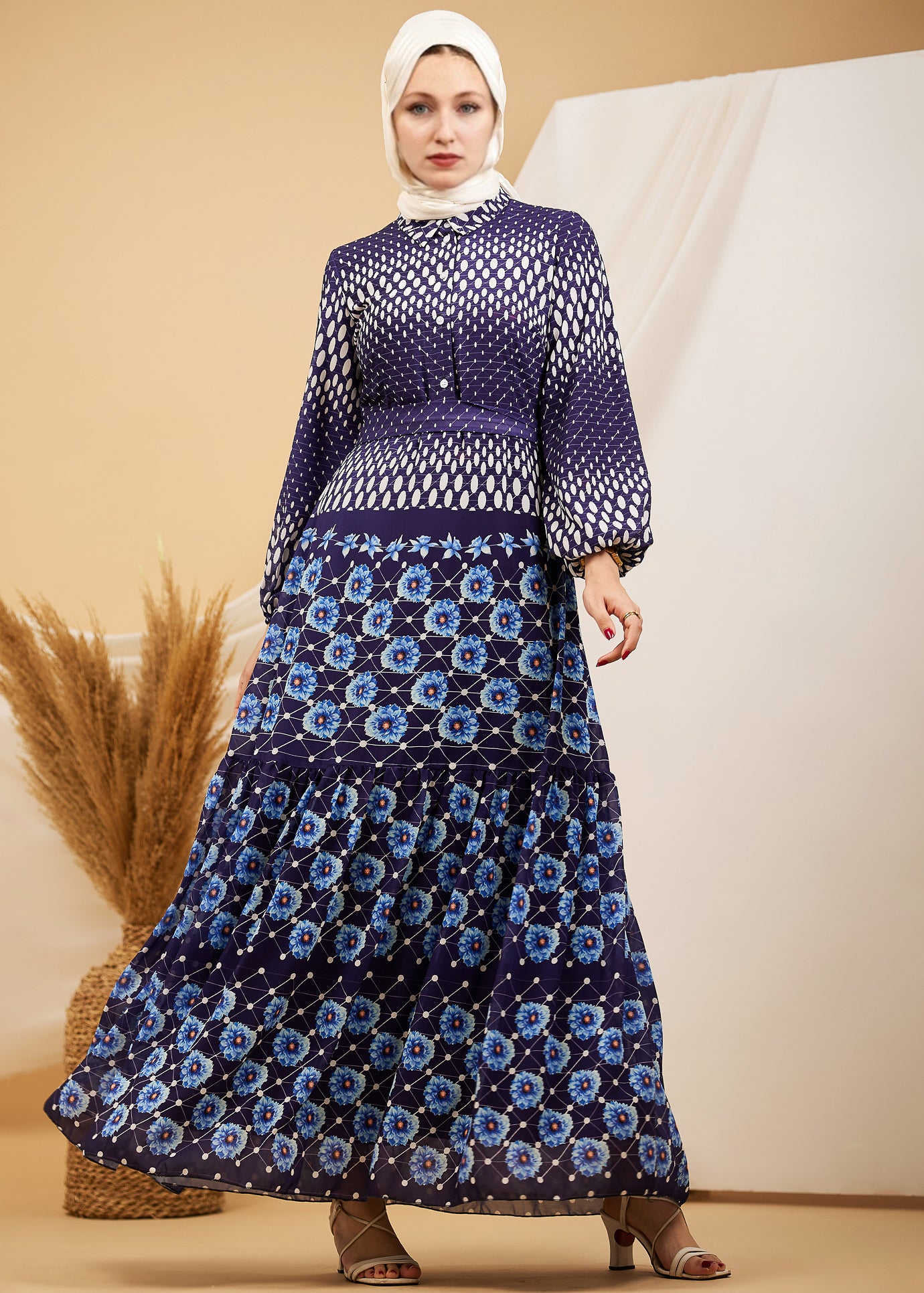 Model wearing the navy floral chiffon maxi dress, highlighting the modest design