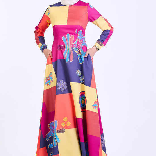 Front view of vibrant patchwork crepe maxi dress with abstract print