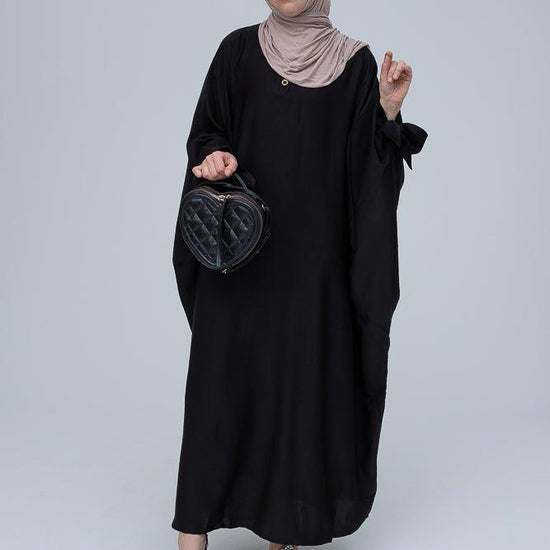 Ikella black batwing abaya with buttons and bow sleeve details - ANNAH HARIRI