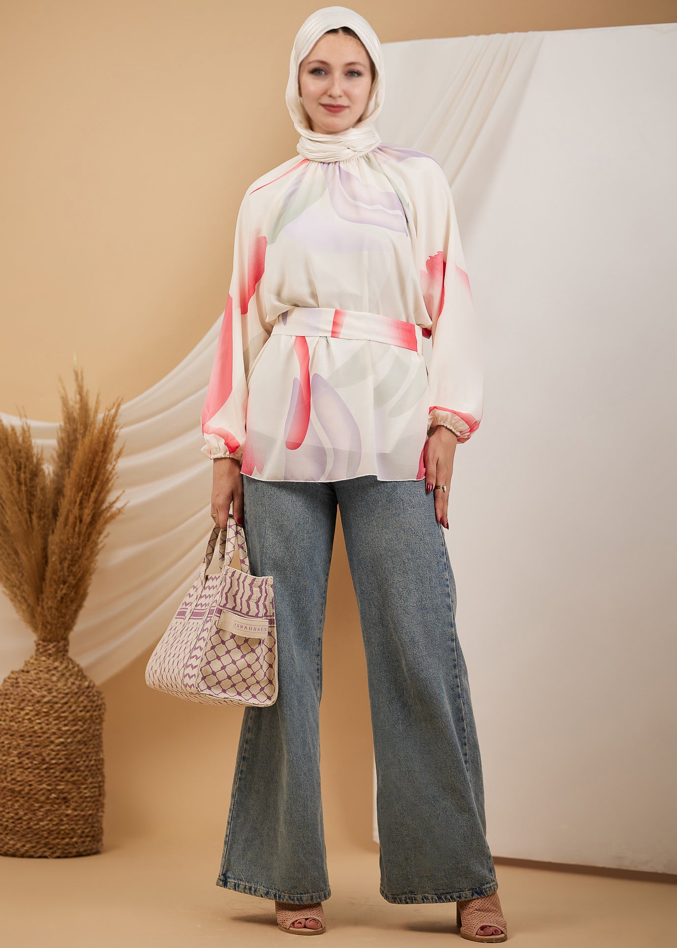 Front view of the radiant chiffon high neck blouse with abstract print