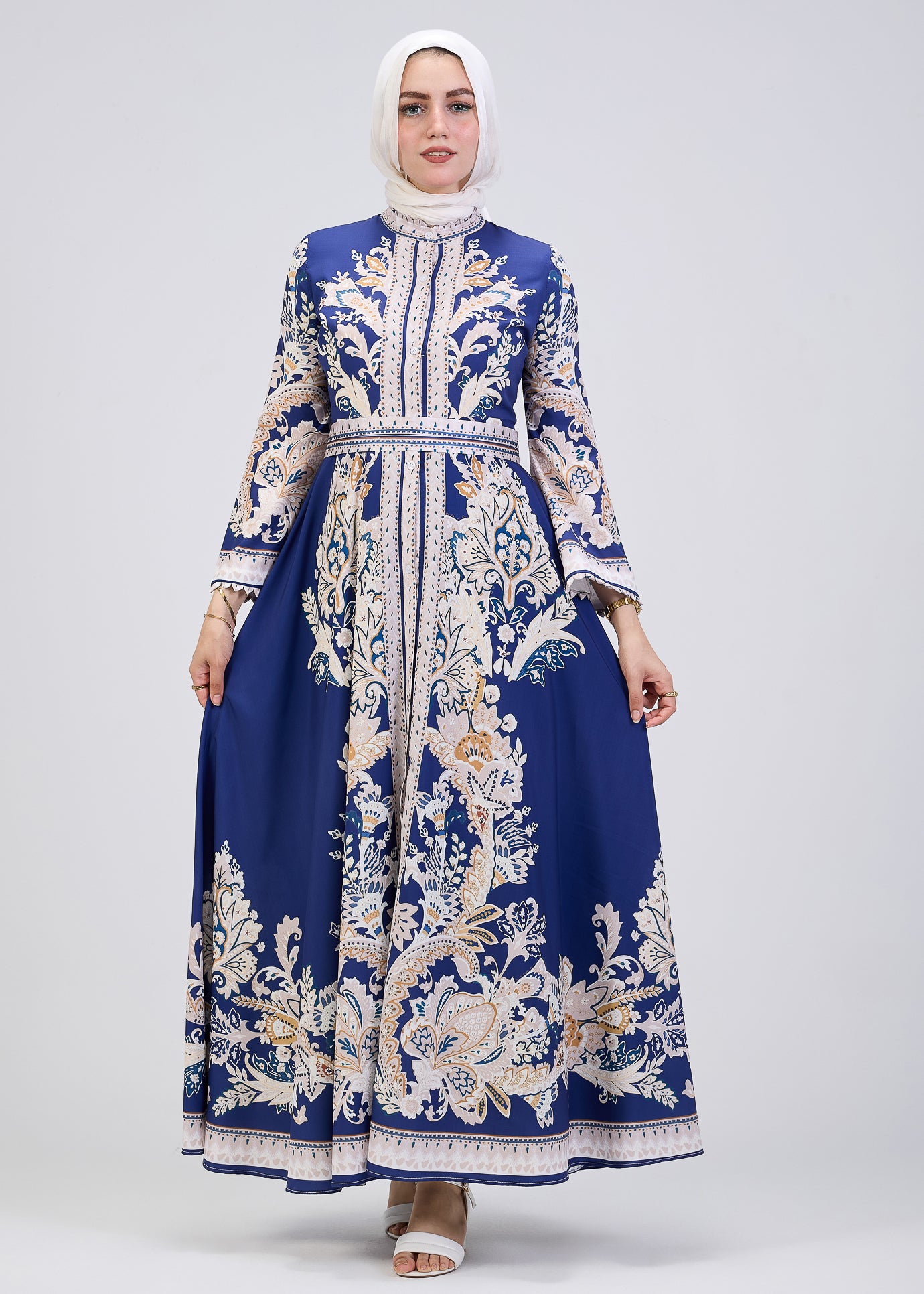 Close-up of bodice design on royal blue floral modest dress