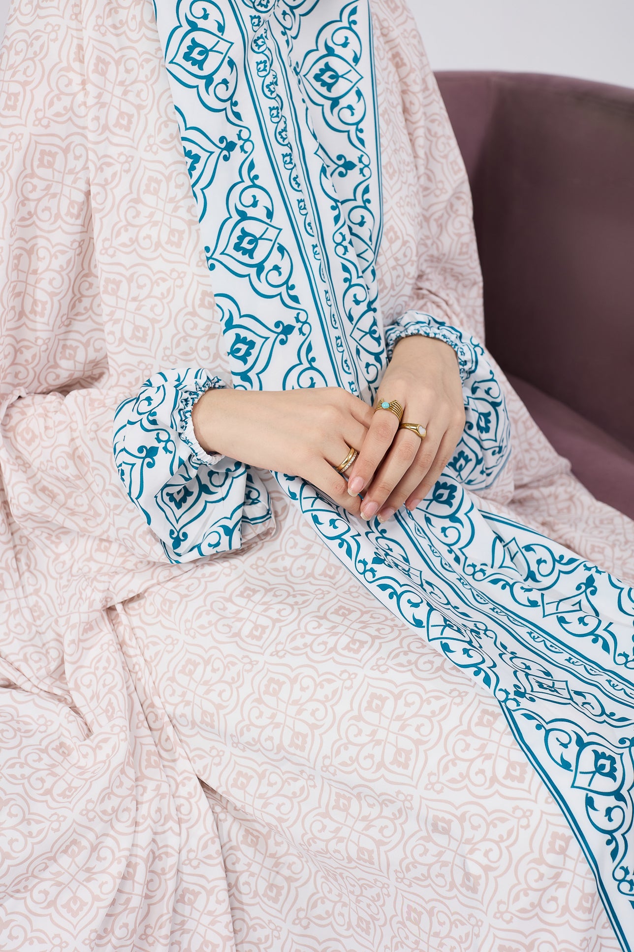 Close-up of blue Moroccan print on satin gown