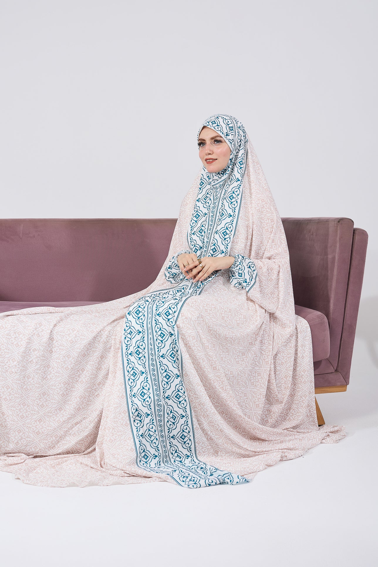 Praying pose in satin prayer gown with Moroccan print