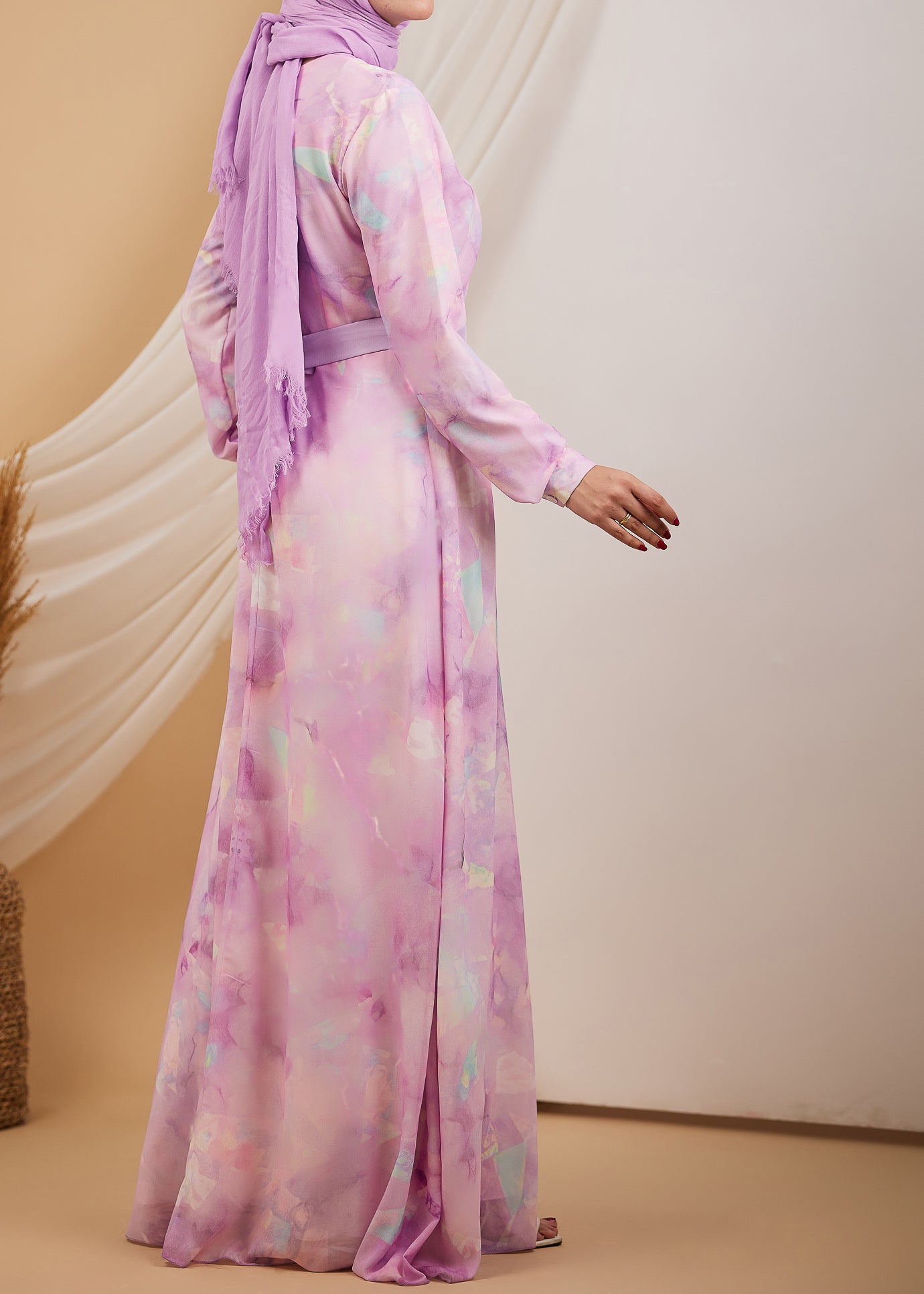 Side view of a lavender high neck chiffon maxi dress, highlighting the delicate fabric