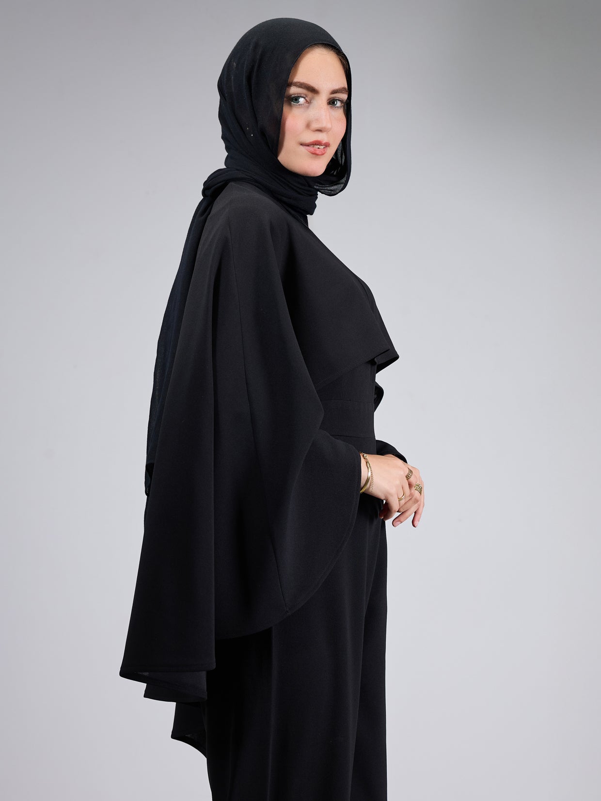 Side view showcasing the cape of the modesty dress