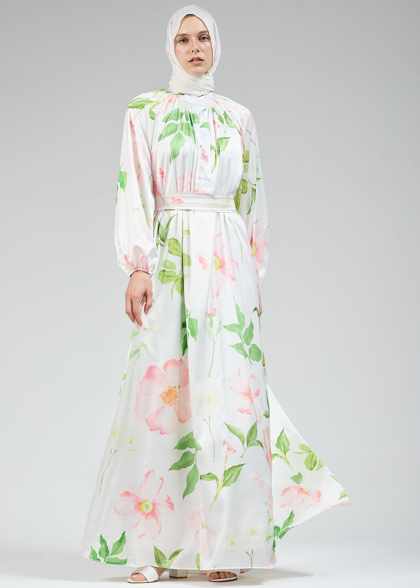 Side view of the white floral satin dress with long sleeves
