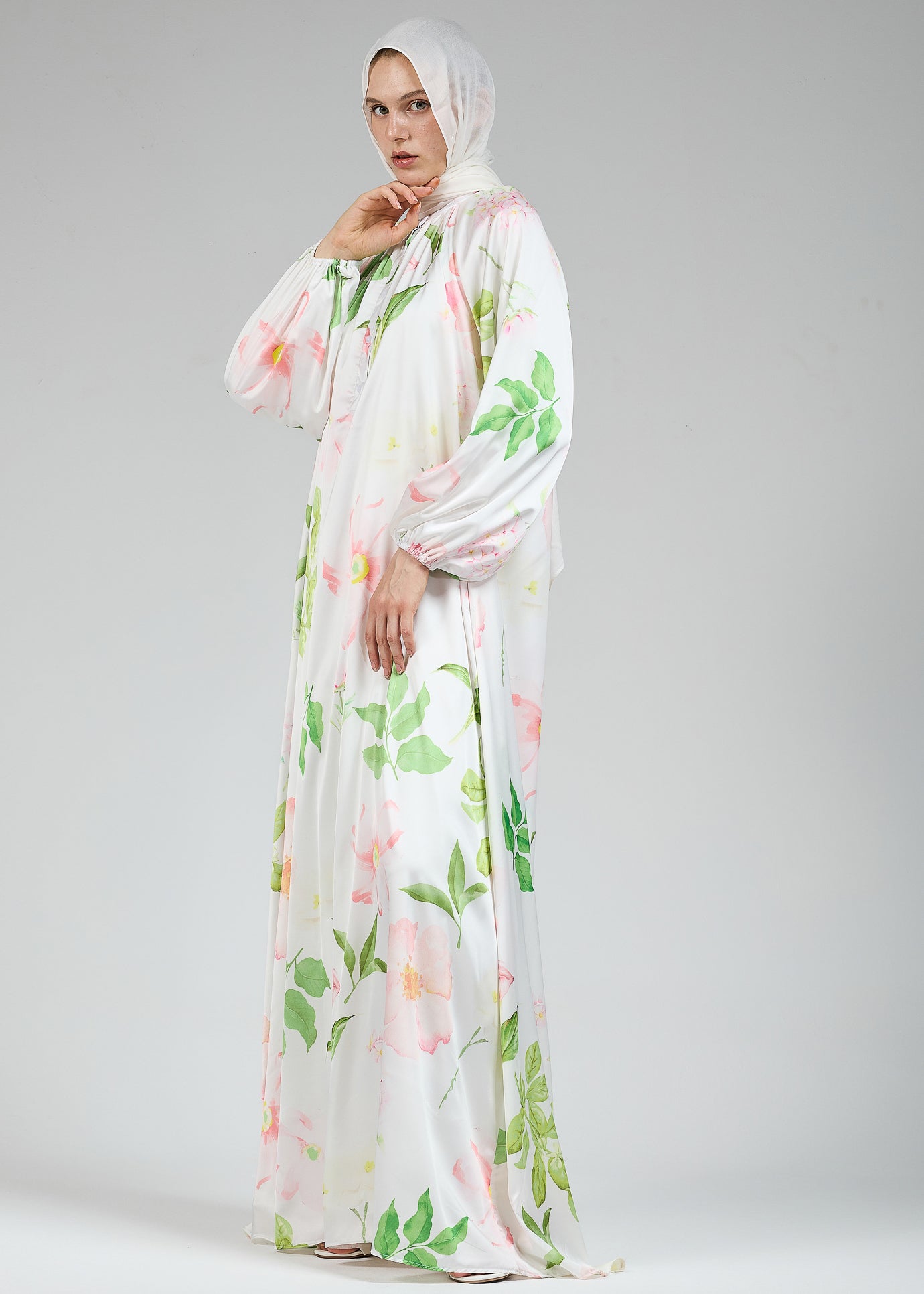 Side view of the white floral satin dress with long sleeves