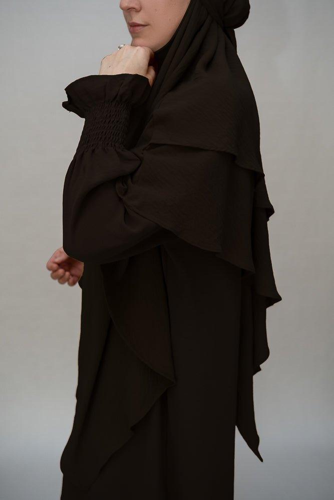 Black abaya dress with functional pockets for convenience