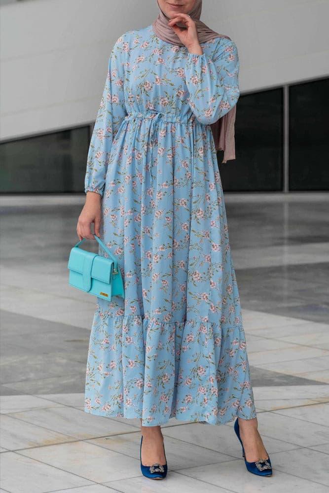 Model posing in Blossom Blue Floral Maxi Dress