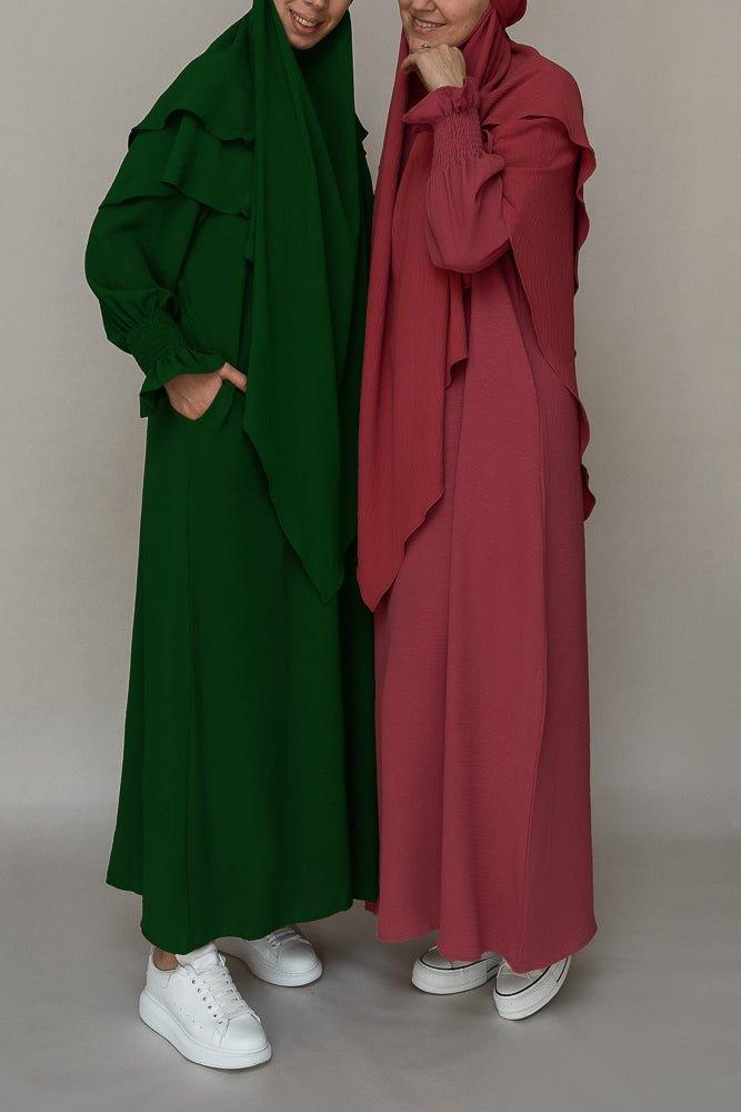 Back view of the dark green modest dress by Annah Hariri